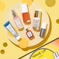 Ceramic Slip, Pink Drink, C.E.O. Serum, C.E.O. Glow, Good Genes and Auto Correct bottles  lay over a light yellow circle with shadow and other smaller yellow and gold circles on a holiday theme shot