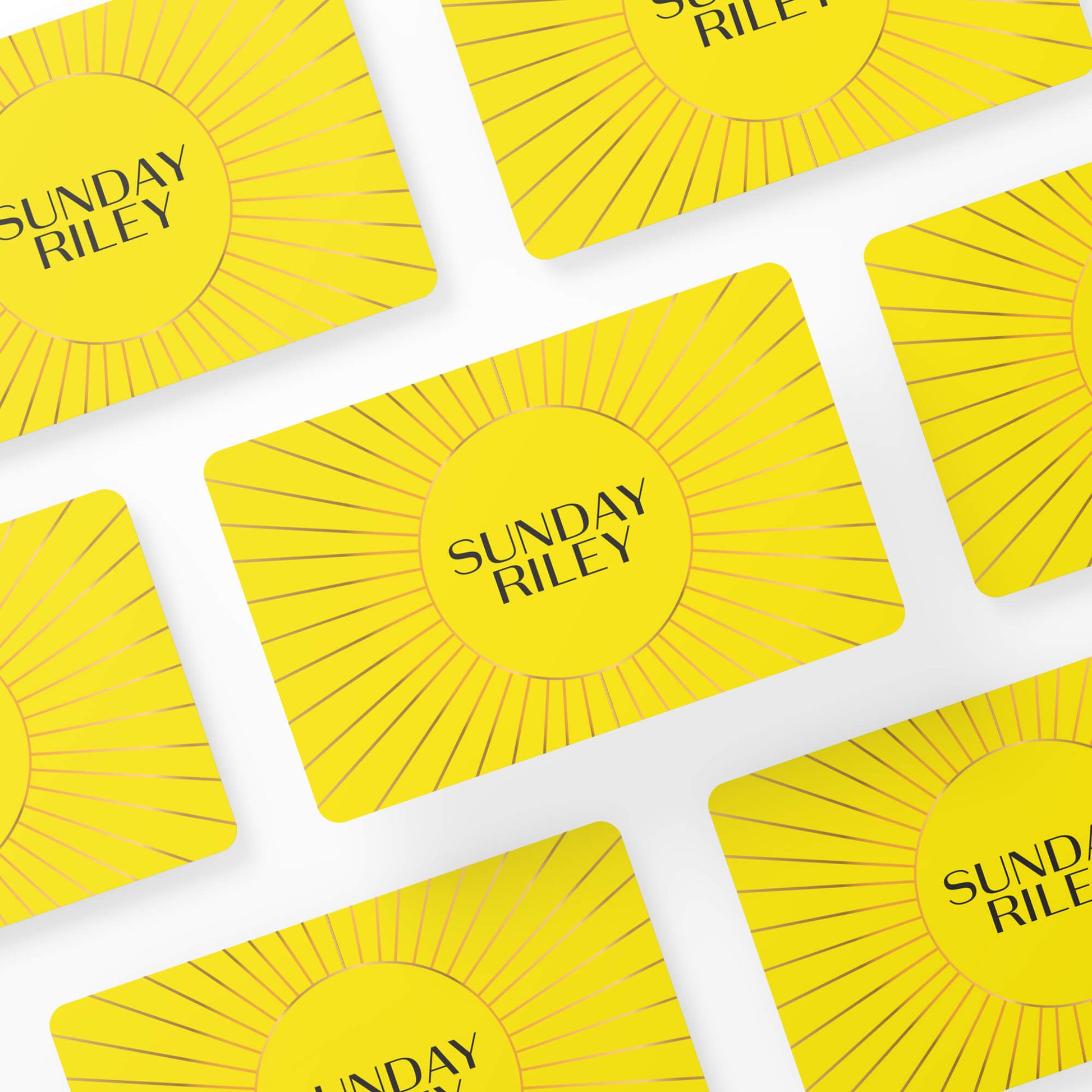 Multiple Sunday Riley Gift Cards layed down in symmetry on a white background