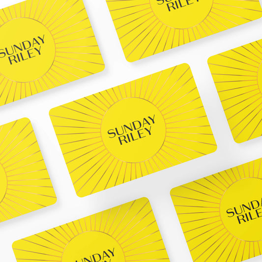 Multiple Sunday Riley Gift Cards layed down in symmetry on a white background