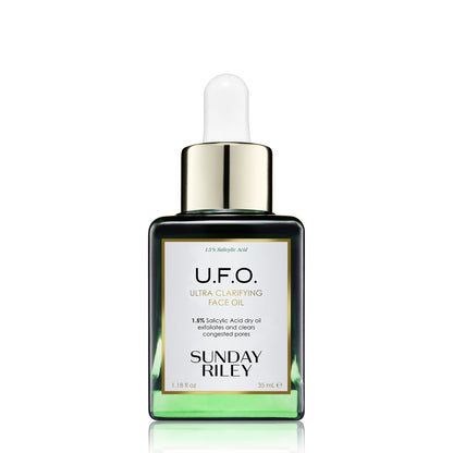 U.F.O. Ultra-Clarifying Face Oil in a green gradient glass bottle with silicon dropper.